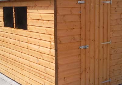 shed clad in untreated tonge and groove wood